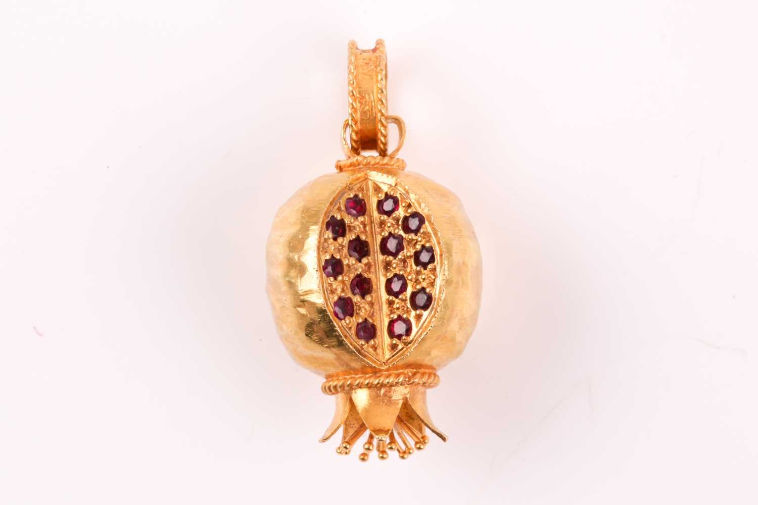 Lot 1 - An 18ct yellow gold and ruby pomegranate...