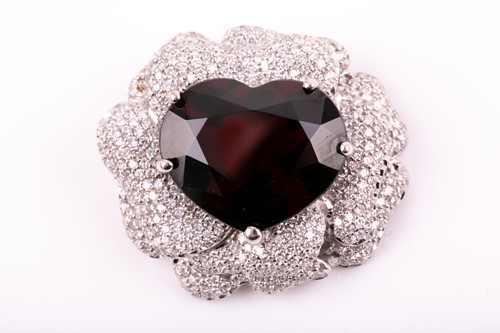 Lot 174 - An 18ct white gold, diamond, and garnet floral...
