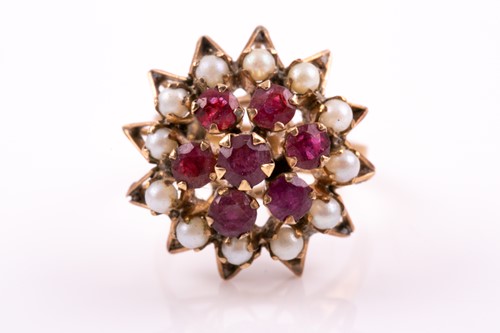 Lot 364 - A yellow metal, ruby, and pearl cocktail ring,...