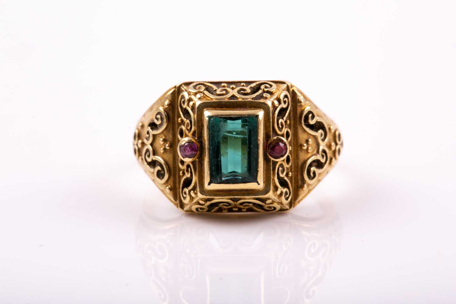 Lot 263 - A yellow metal and gemstone ring, set with a...