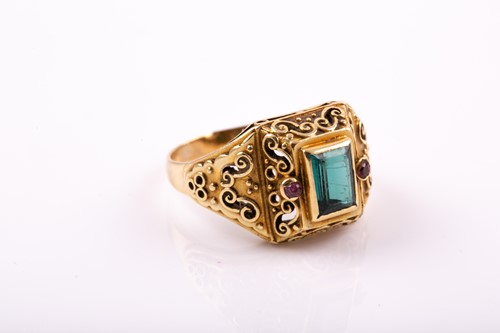 Lot 263 - A yellow metal and gemstone ring, set with a...