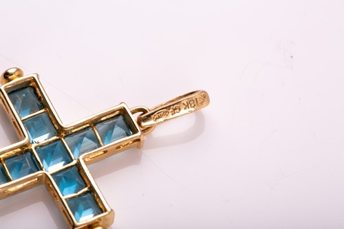 Lot 8 - An 18ct yellow gold and blue topaz cross...