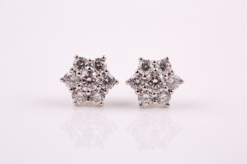 Lot 18 - A pair of 18ct white gold and diamond stud...