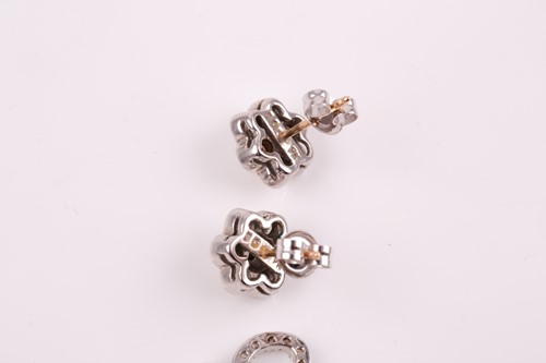 Lot 59 - A pair of 9ct white gold and diamond floral...