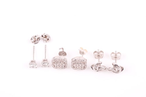 Lot 4 - A pair of 9ct white gold and solitaire CZ stud...