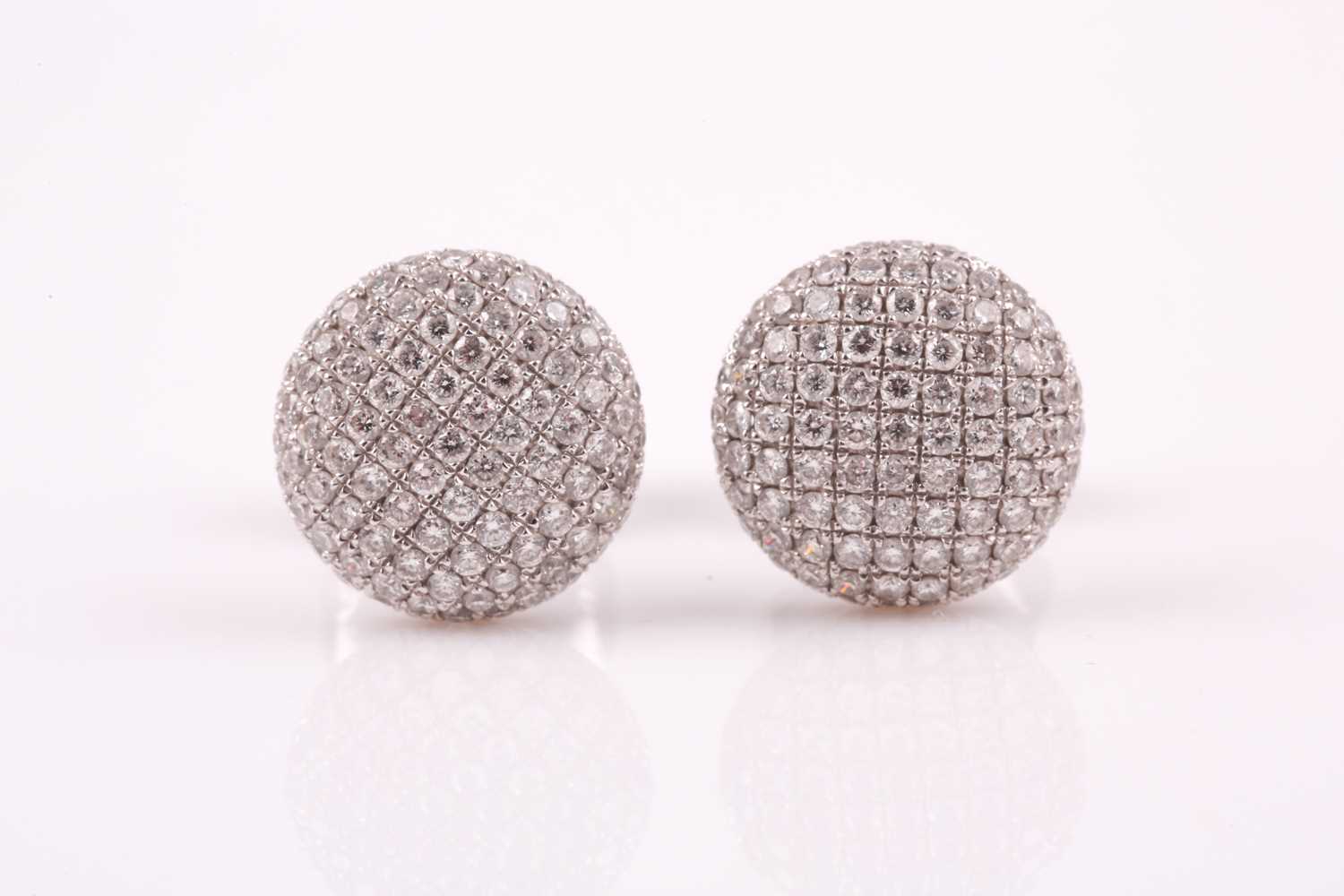 Lot 141 - A pair of 18ct white gold and diamond earrings,...