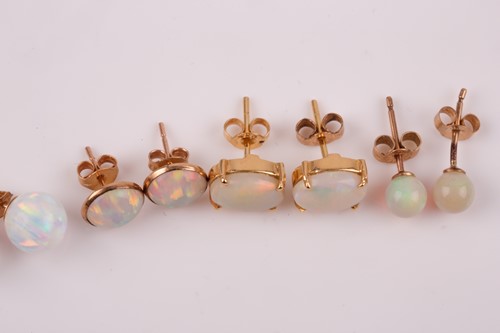 Lot 193 - A pair of yellow metal and opal earrings set...