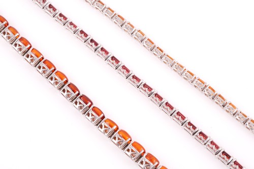 Lot 181 - A silver and garnet line bracelet, set with...