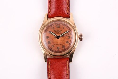 Lot 609 - A vintage military style watch, the circular...