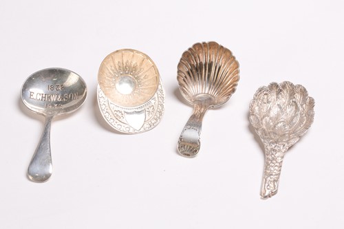 Lot 528 - A cast silver caddy spoon in the shape of an...