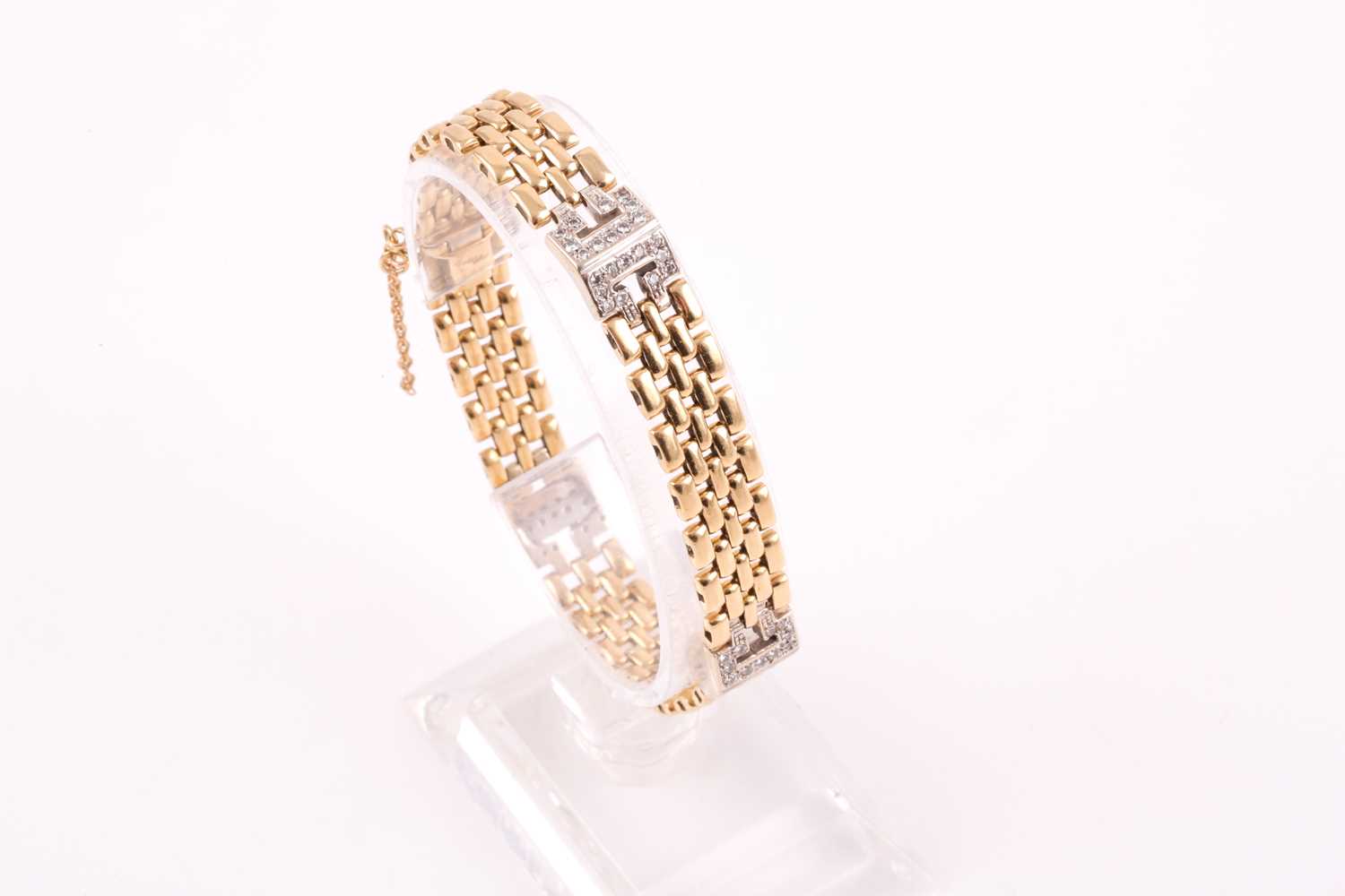 Lot 2 - An 18ct yellow gold and diamond bracelet, the...