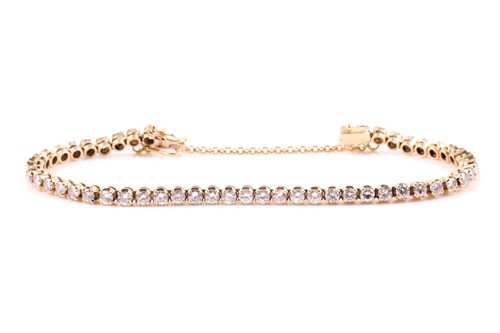 Lot 163 - An 18ct yellow gold and diamond line bracelet,...