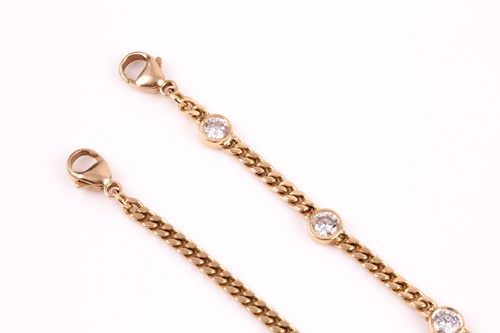 Lot 168 - An 18ct yellow gold and diamond bracelet, the...