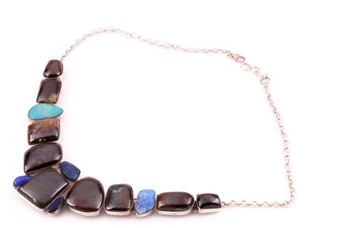 Lot 139 - A silver and opal segmented necklace, set with...