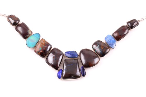 Lot 139 - A silver and opal segmented necklace, set with...