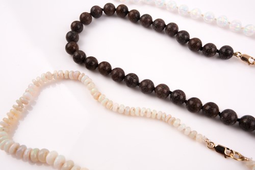 Lot 149 - A faceted opal bead necklace, together with a...