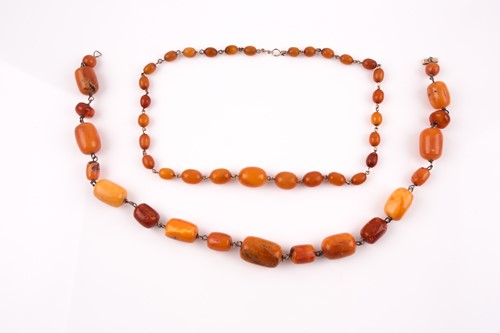 Lot 133 - A buttercotch amber and gilt metal necklace...