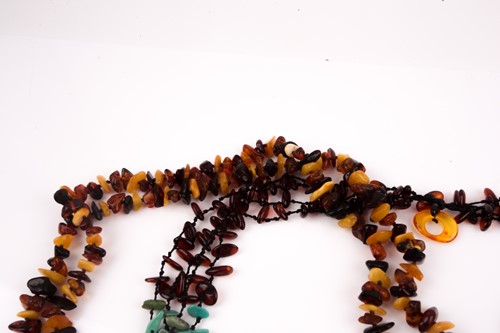Lot 96 - An opera-length multi-coloured amber necklace,...