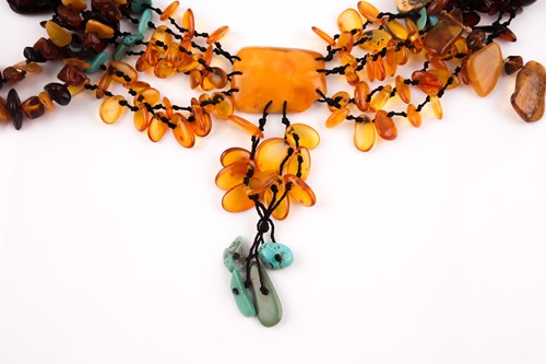 Lot 96 - An opera-length multi-coloured amber necklace,...
