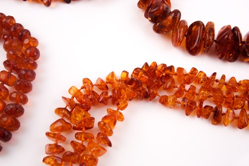 Lot 110 - A treated amber necklace, of naturalistic...