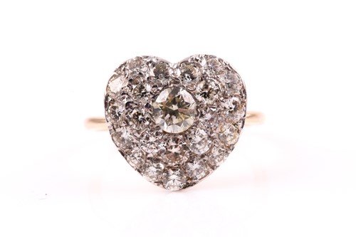 Lot 508 - A yellow metal and diamond heart-shaped...