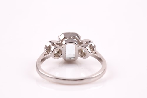 Lot 220 - A diamond, aquamarine, and platinum ring, set...