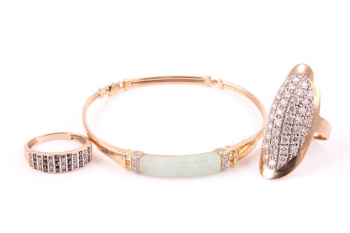 Lot 499 - A 9ct gold, jade and diamond bangle, with...