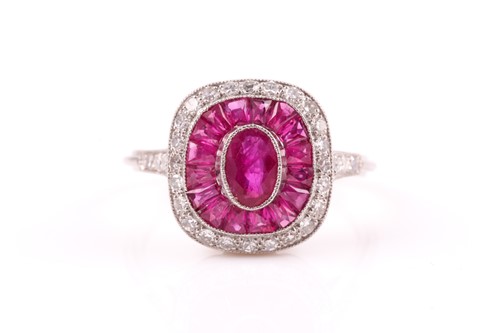 Lot 237 - A diamond and ruby dress ring, centred with a...