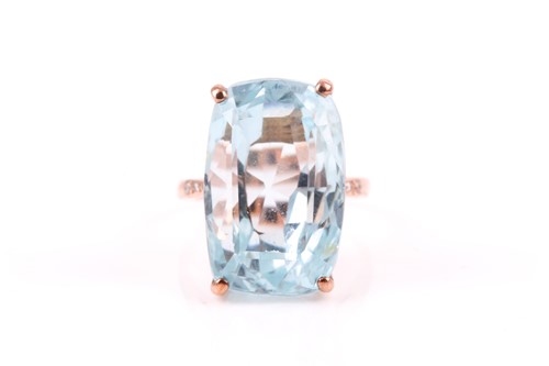 Lot 495 - An 18ct rose gold and blue topaz cocktail ring,...