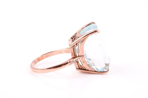 Lot 495 - An 18ct rose gold and blue topaz cocktail ring,...