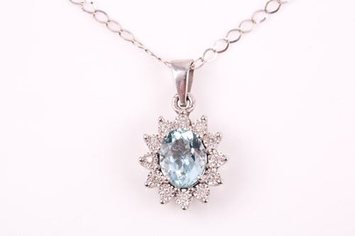 Lot 218 - A diamond and aquamarine pendant, set with a...