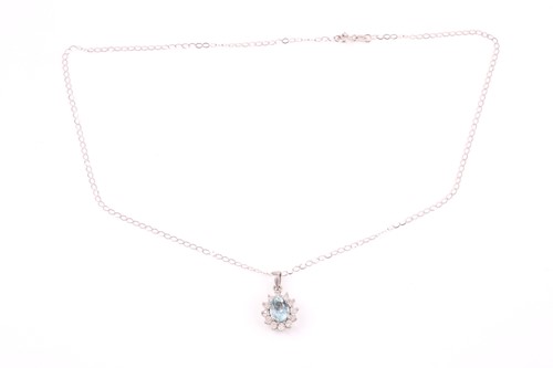 Lot 218 - A diamond and aquamarine pendant, set with a...