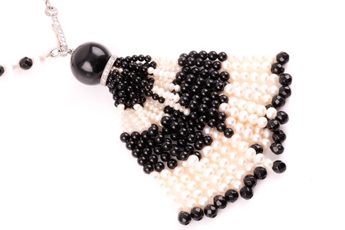 Lot 40 - An onyx and pearl sautoir necklace in the Art...