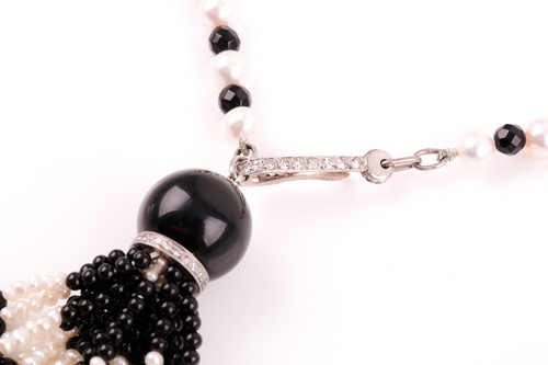 Lot 40 - An onyx and pearl sautoir necklace in the Art...