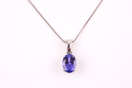Lot 412 - A platinum and tanzanite pendant, set with a...