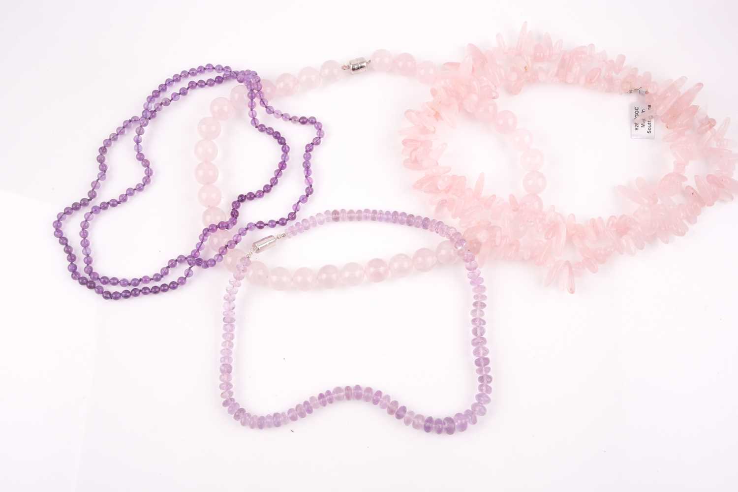 Lot 69 - A rose quartz beaded necklace, the beads...