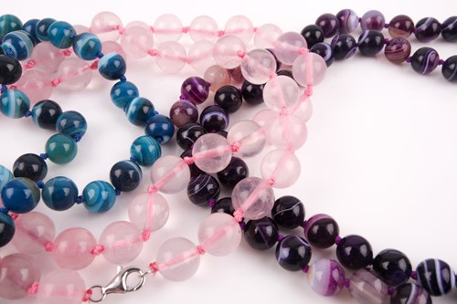 Lot 29 - A rose quartz long beaded necklace, with pink...