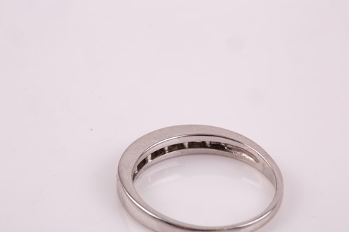 Lot 268 - A white gold and diamond half eternity ring,...