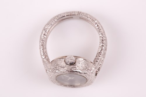 Lot 379 - An unusual 18ct white gold watch-ring by...
