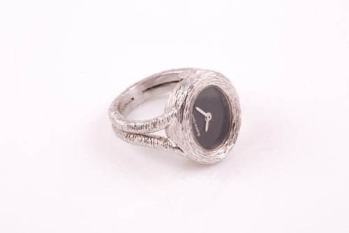Lot 379 - An unusual 18ct white gold watch-ring by...