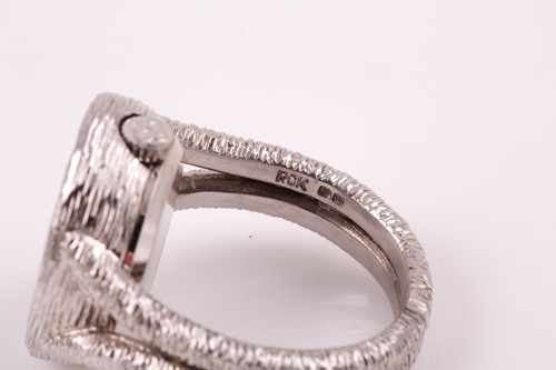 Lot 379 - An unusual 18ct white gold watch-ring by...