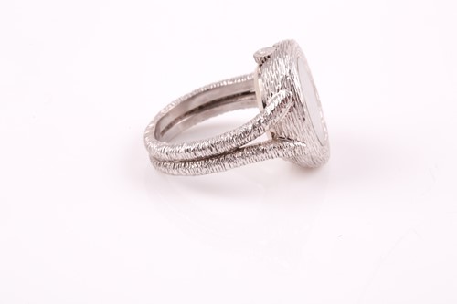 Lot 379 - An unusual 18ct white gold watch-ring by...