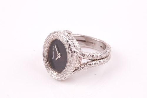 Lot 379 - An unusual 18ct white gold watch-ring by...