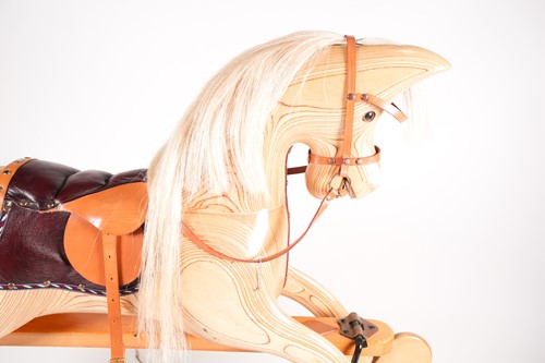 Lot 63 - A laminated pine rocking horse, by Ian...