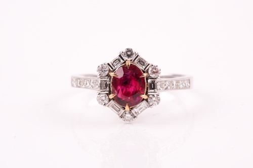 Lot 224 - A ruby and diamond cluster ring, the cushion...