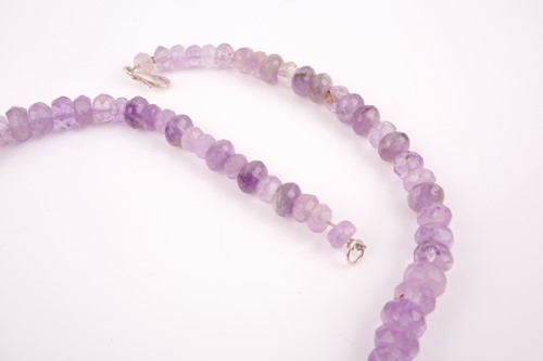 Lot 119 - A faceted amethyst beaded necklace, 51 cm long,...