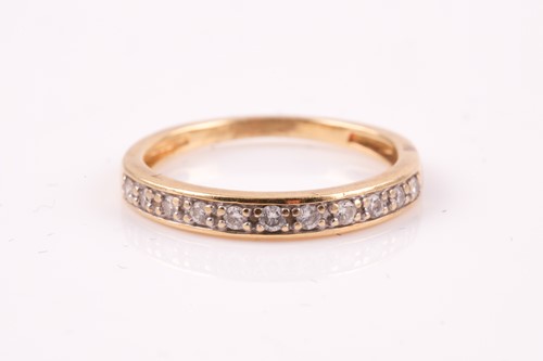 Lot 485 - A diamond half hoop eternity ring, the round...