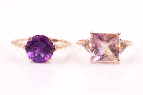 Lot 497 - A single stone circular amethyst ring in four...