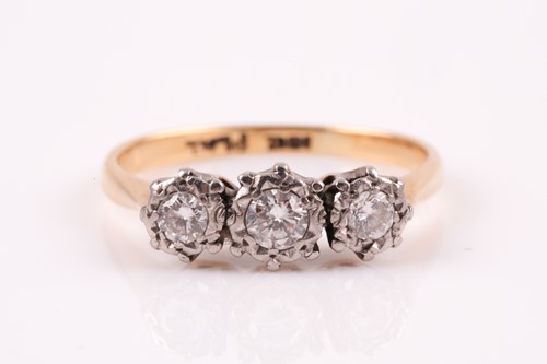 Lot 333 - A three stone diamond half hoop ring, the...