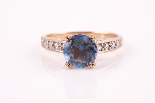 Lot 433 - A single stone coated blue topaz ring, with...